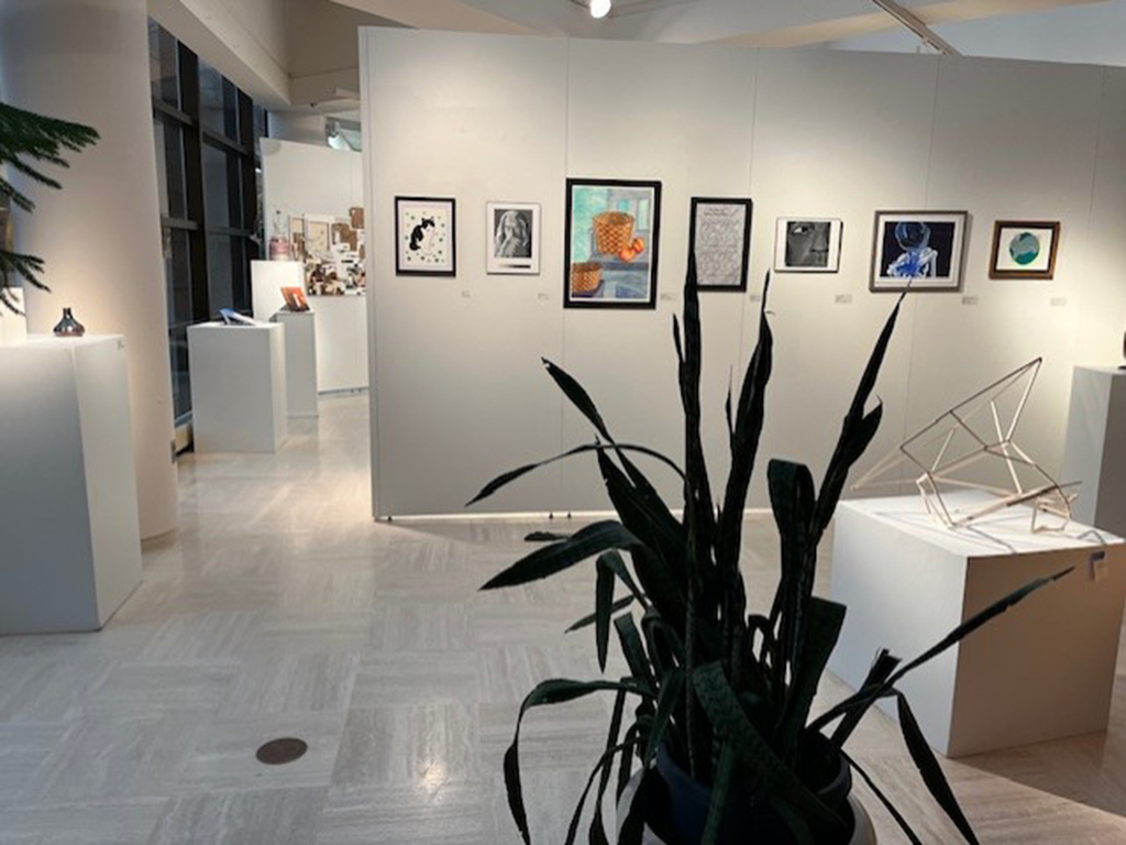 back side of back section of the student show with various works of art